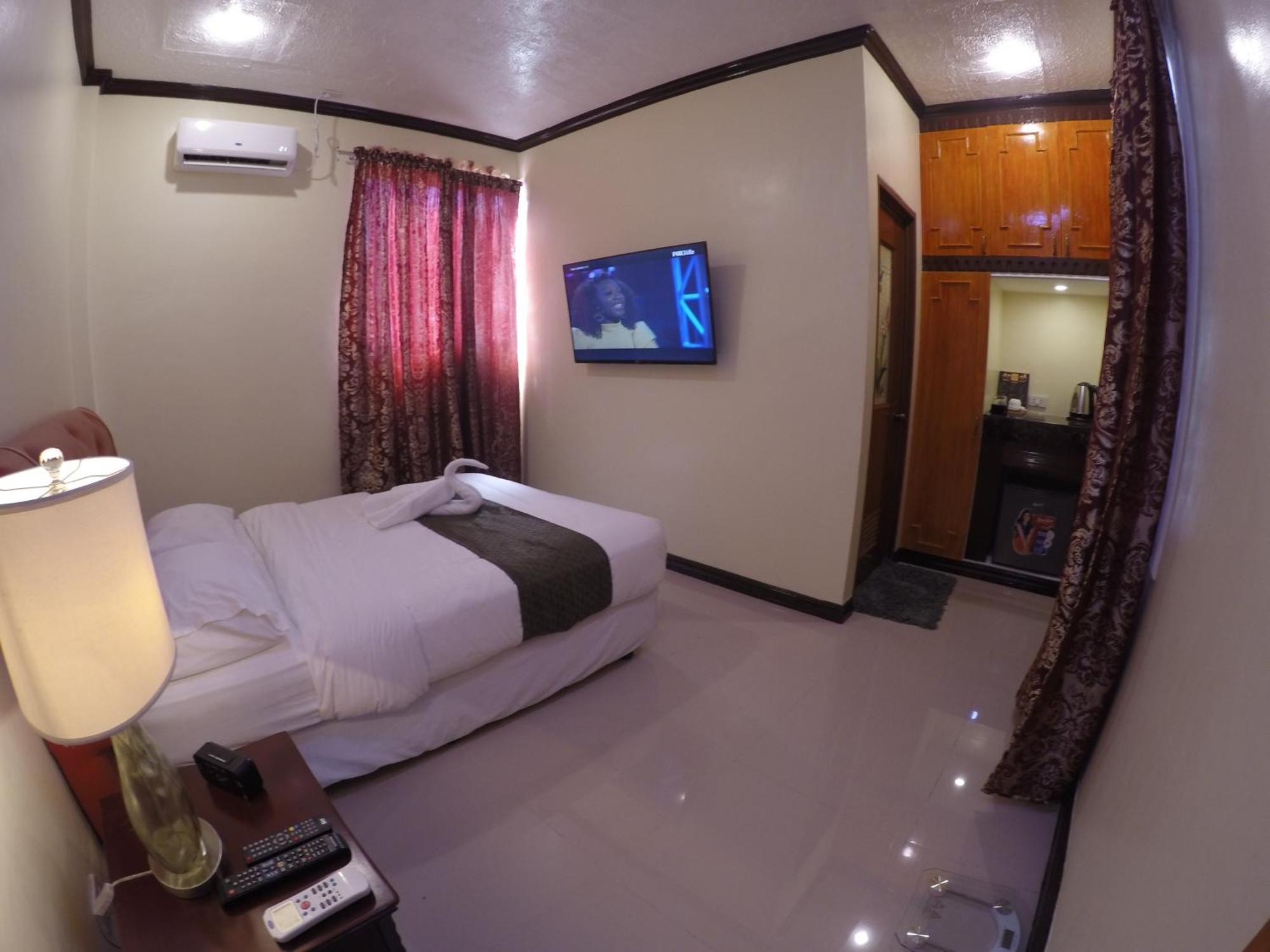 The Executive Villa Inn & Suites Davao Номер фото